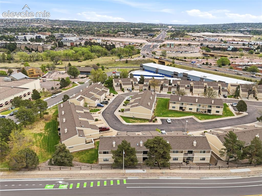 Image 48 of 50: Aerial perspective showcasing a collection of multi-unit buildings with neu