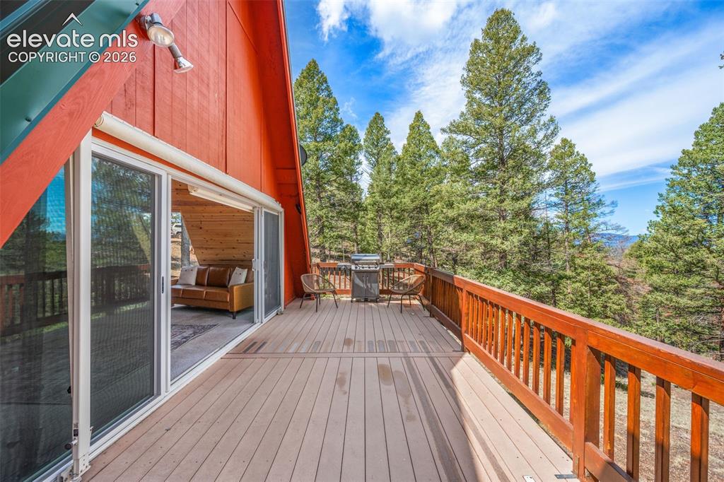 Image 22 of 32: Enjoy the spacious deck with a pull out sun shade for flexible comfort and 