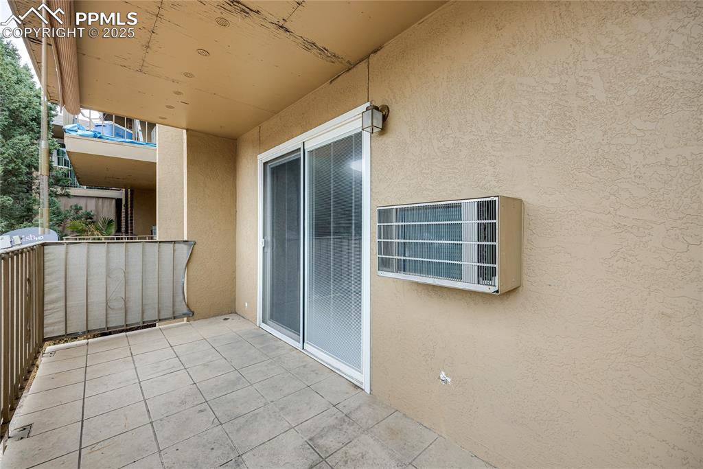 Image 19 of 24: Balcony featuring a wall mounted air conditioner