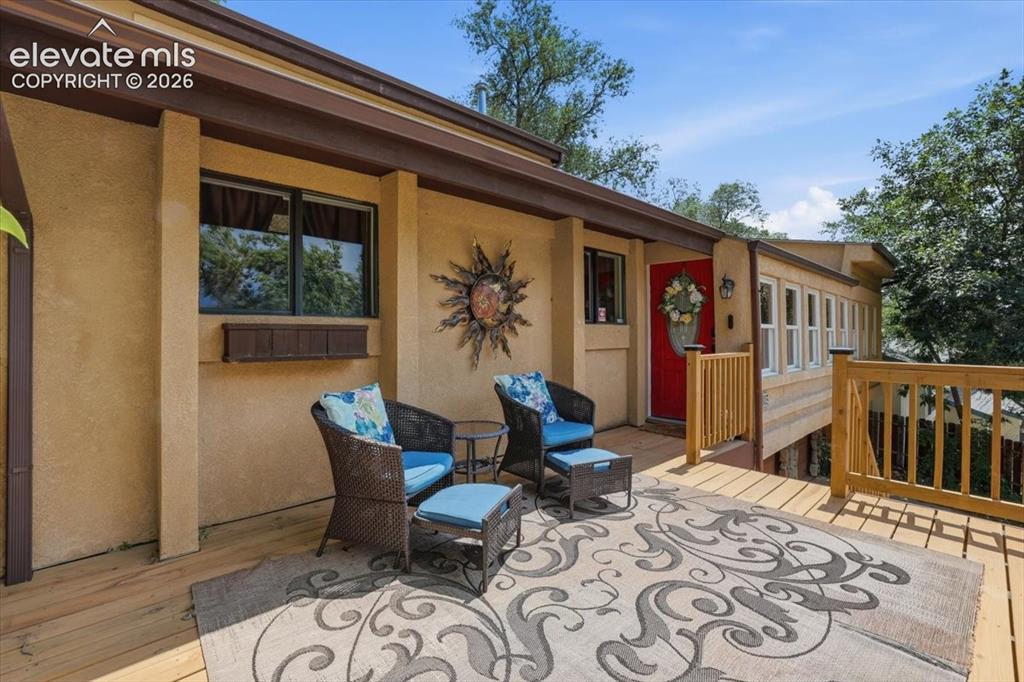 Image 12 of 50: Spacious front deck with sweeping Front Range views.