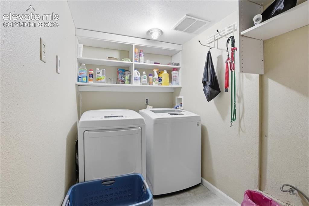 Image 42 of 50: Laundry area in the basement