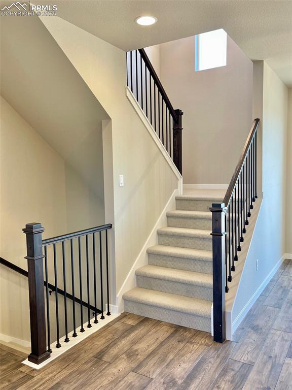 Image 18 of 26: Stairs to upper level
