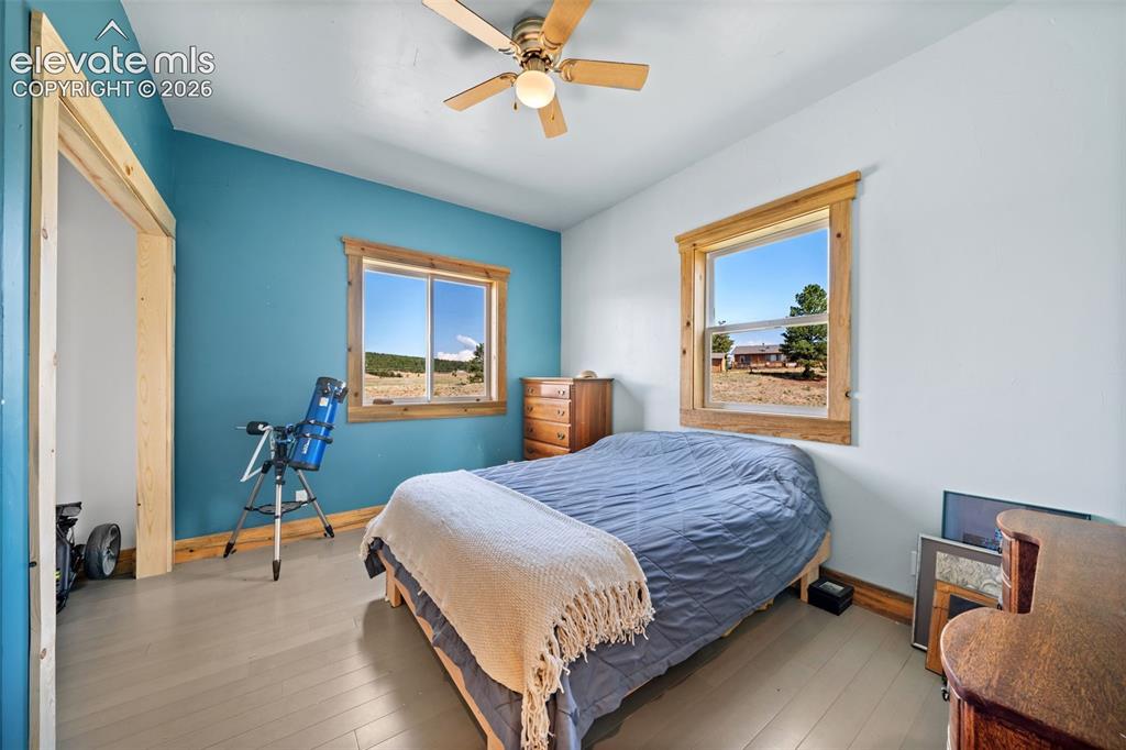 Image 14 of 41: Spacious main-level bedroom with natural light.