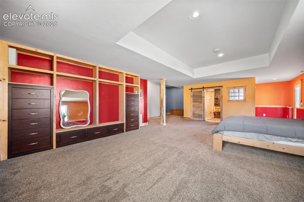 Image 17 of 41: Expansive walkout primary bedroom with abundant space.