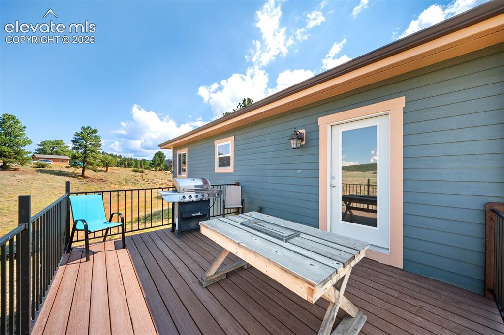 Image 26 of 41: Spacious rear deck, perfect for grilling and entertaining.