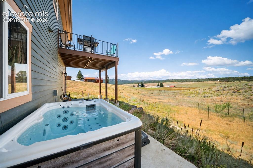 Image 33 of 41: Hot tub with breathtaking mountain and valley views.