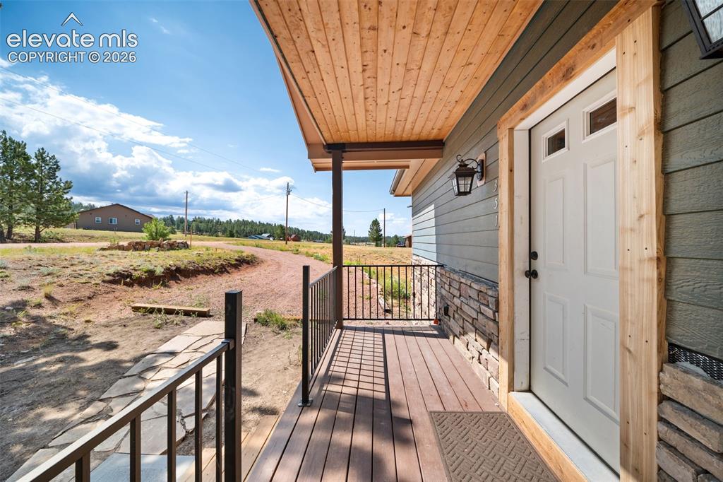 Image 4 of 41: Inviting covered front porch and entry.