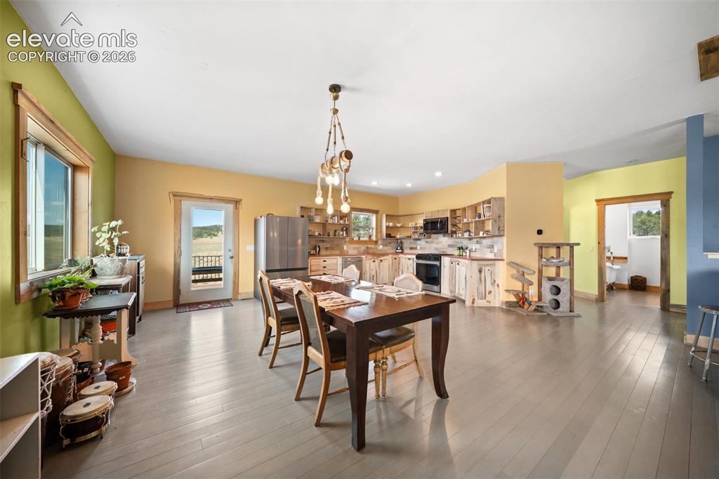 Image 7 of 41: Spacious dining area opens seamlessly to the kitchen.