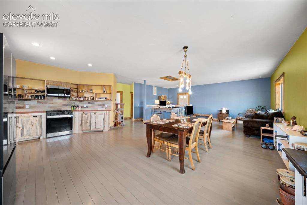 Image 8 of 41: Spacious dining area opens seamlessly to the kitchen.