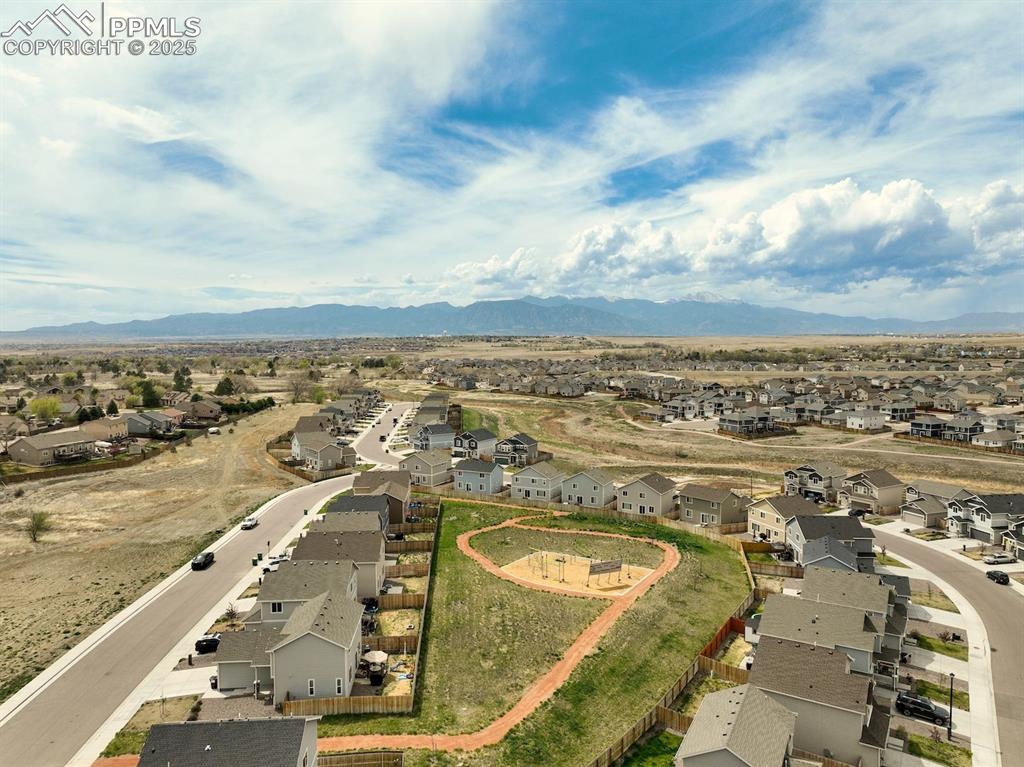 Image 47 of 50: Birds eye view of property featuring a mountain view and a residential view