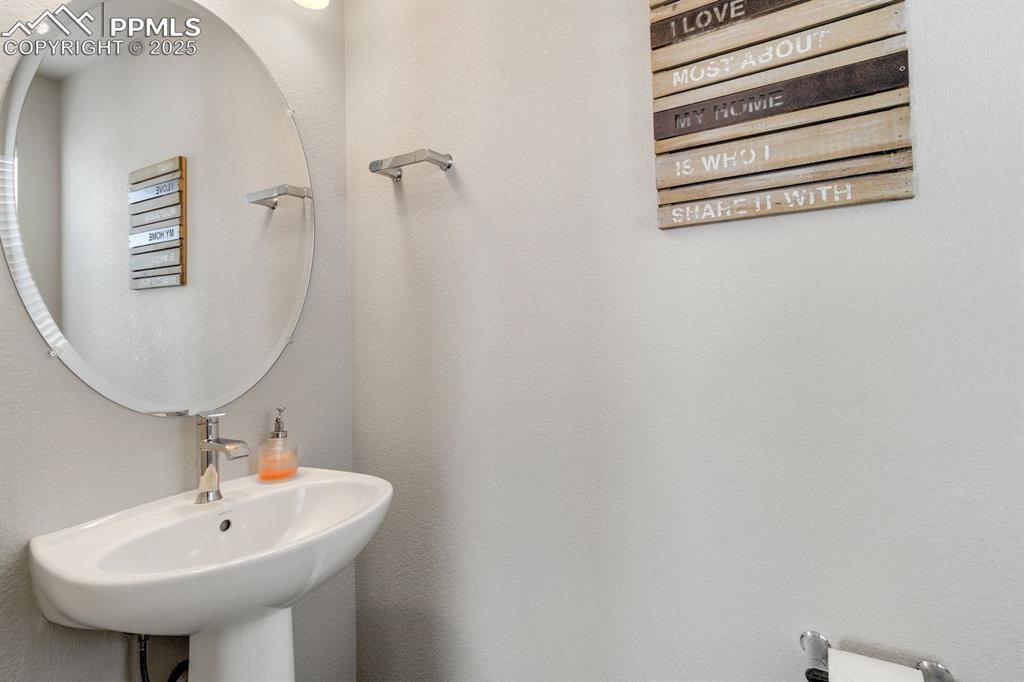 Image 6 of 50: Bathroom with a sink