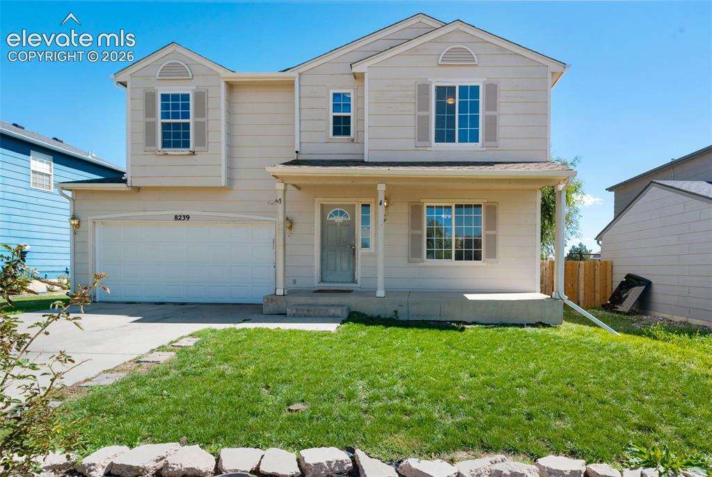 Image 1 of 31: Two-story residence featuring a front entry porch, attached two-car garage,