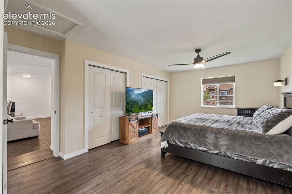 Image 17 of 43: Bedroom featuring wood-finish flooring, a ceiling fan with integrated light