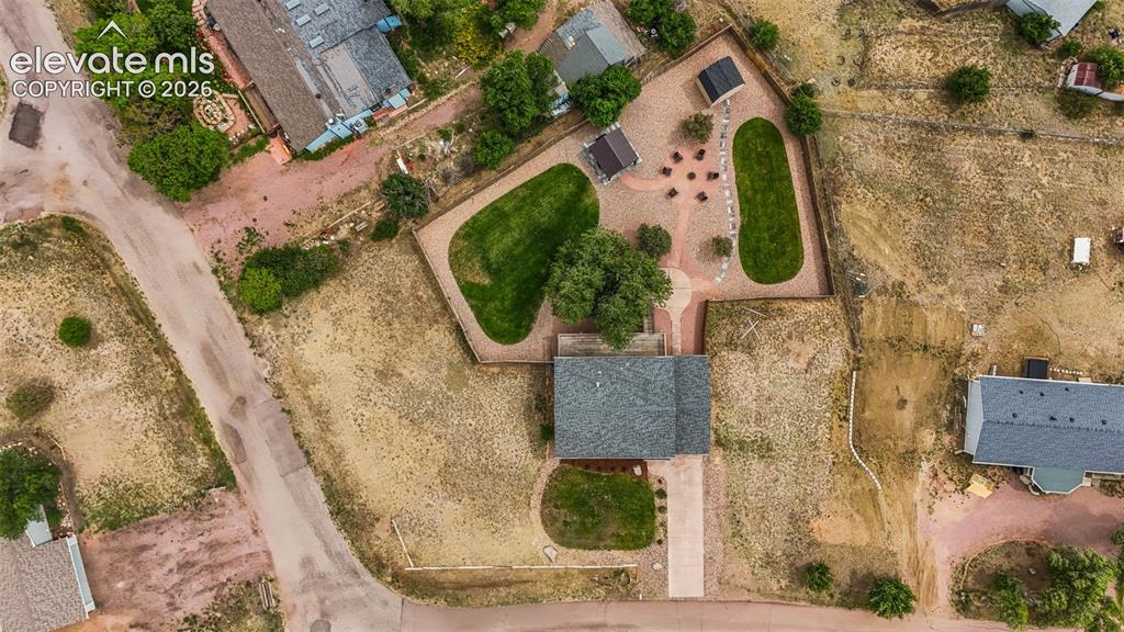 Image 37 of 43: Aerial perspective showcasing a property with a grey shingle roof