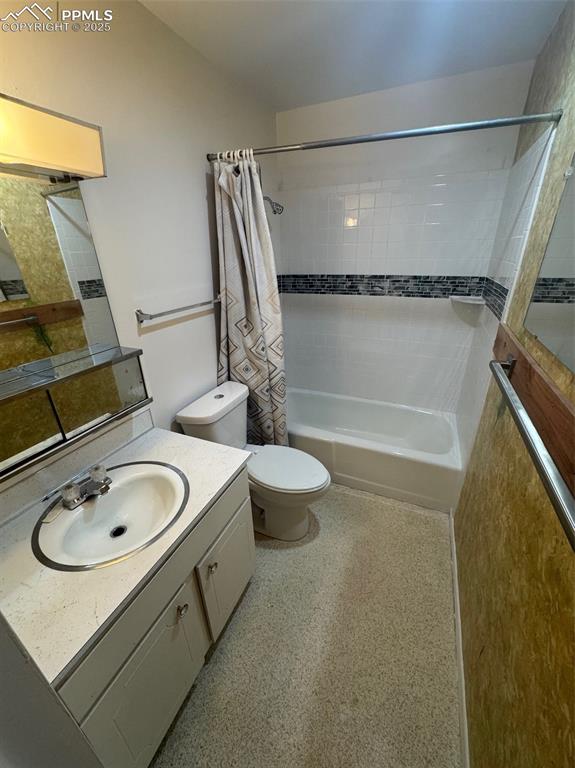 Image 11 of 30: Full bathroom with vanity and shower / bath combination with curtain