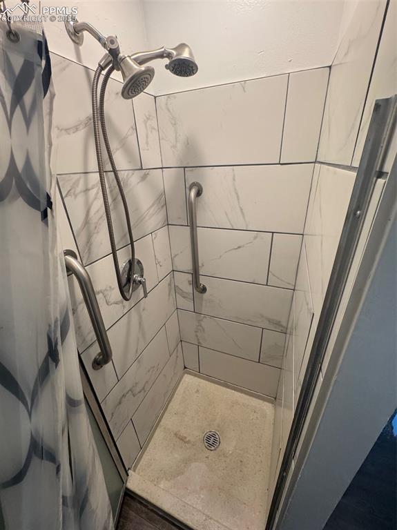 Image 14 of 30: Bathroom with a shower stall