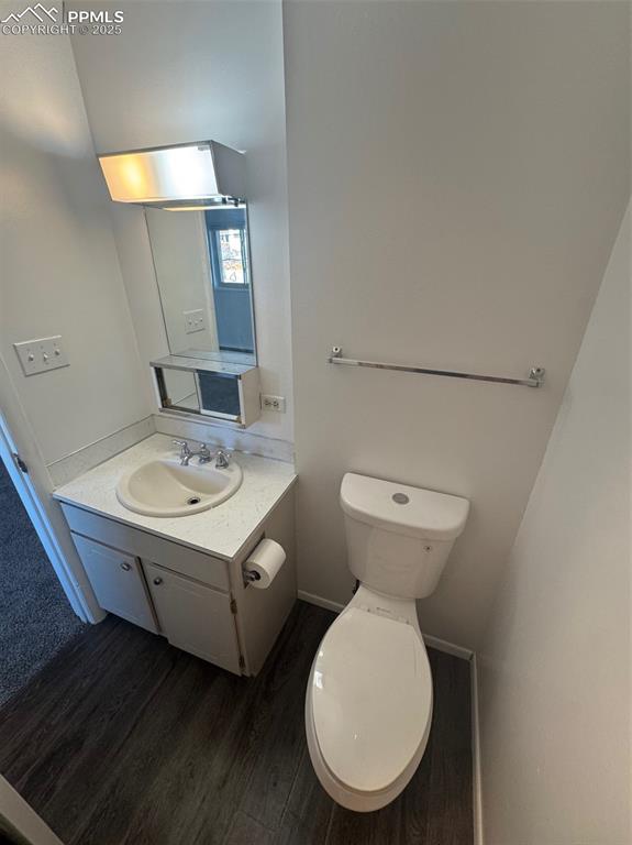 Image 15 of 30: Bathroom featuring vanity and dark wood finished floors