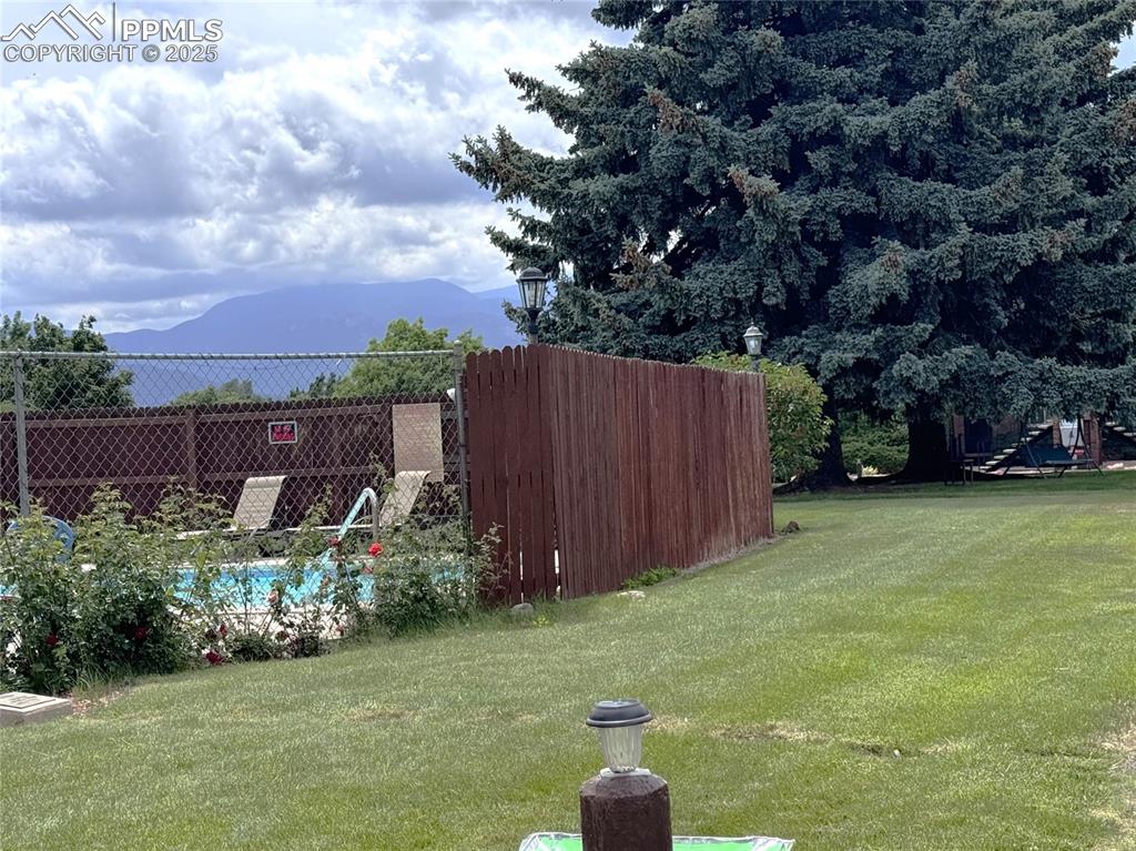 Image 20 of 30: View of yard with a mountain view