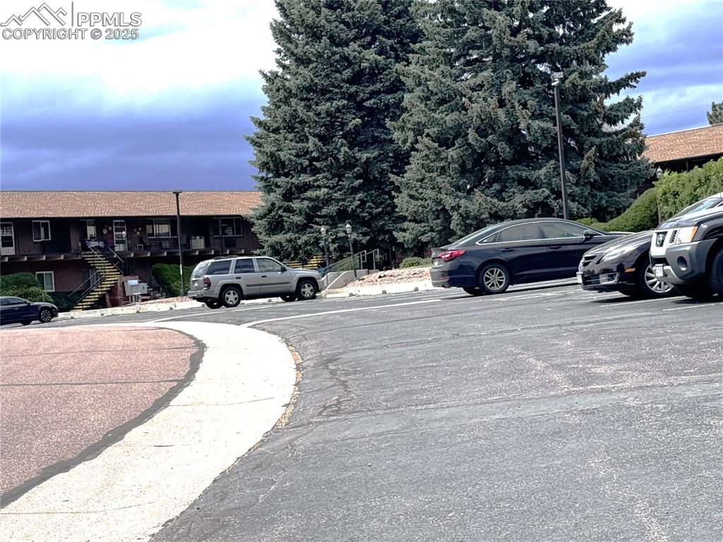 Image 27 of 30: View of asphalt road featuring street lighting