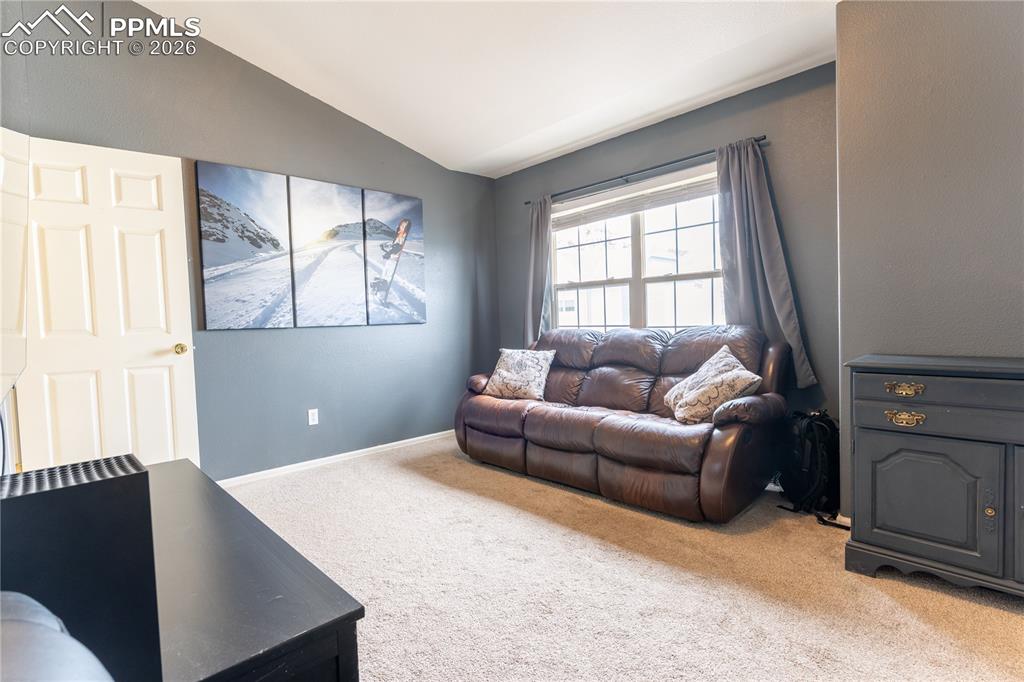 Image 14 of 23: Bedroom with lofted ceiling