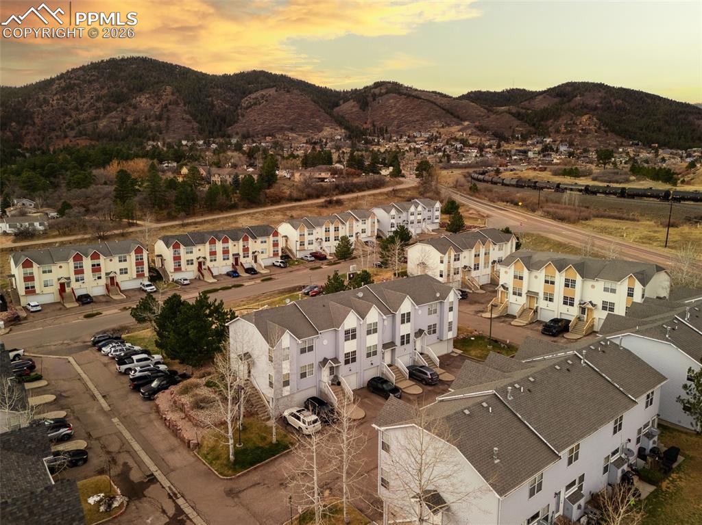 Image 2 of 23: Aerial view of residential area with mountains