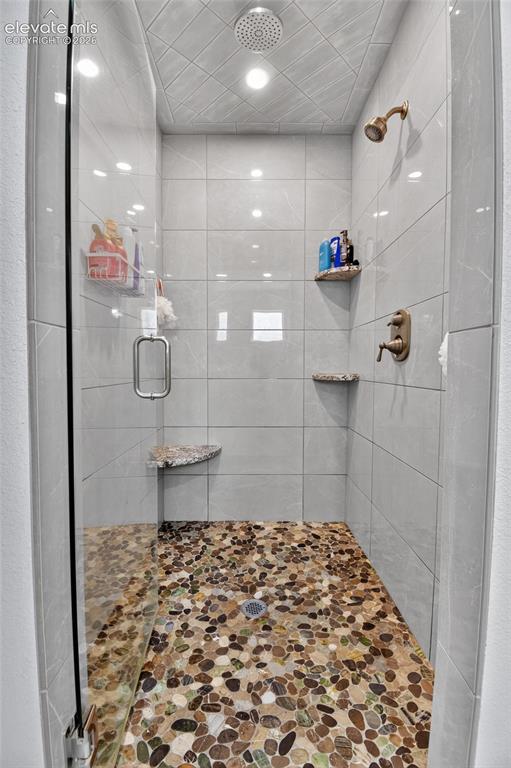 Image 22 of 38: Beautiful tiled shower