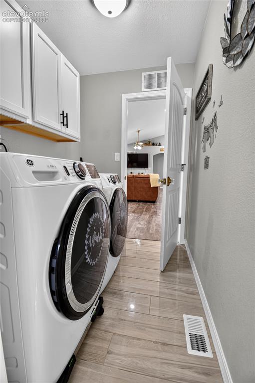 Image 24 of 38: Laundry room off primary bathroom