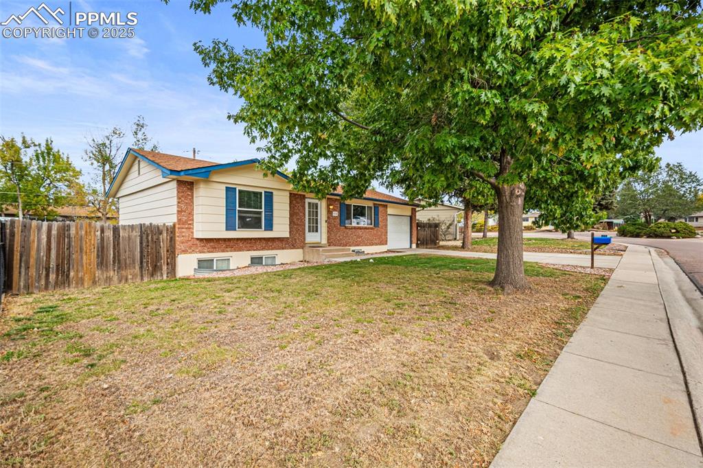 Image 3 of 33: View of front of home featuring brick siding, concrete driveway, and an att