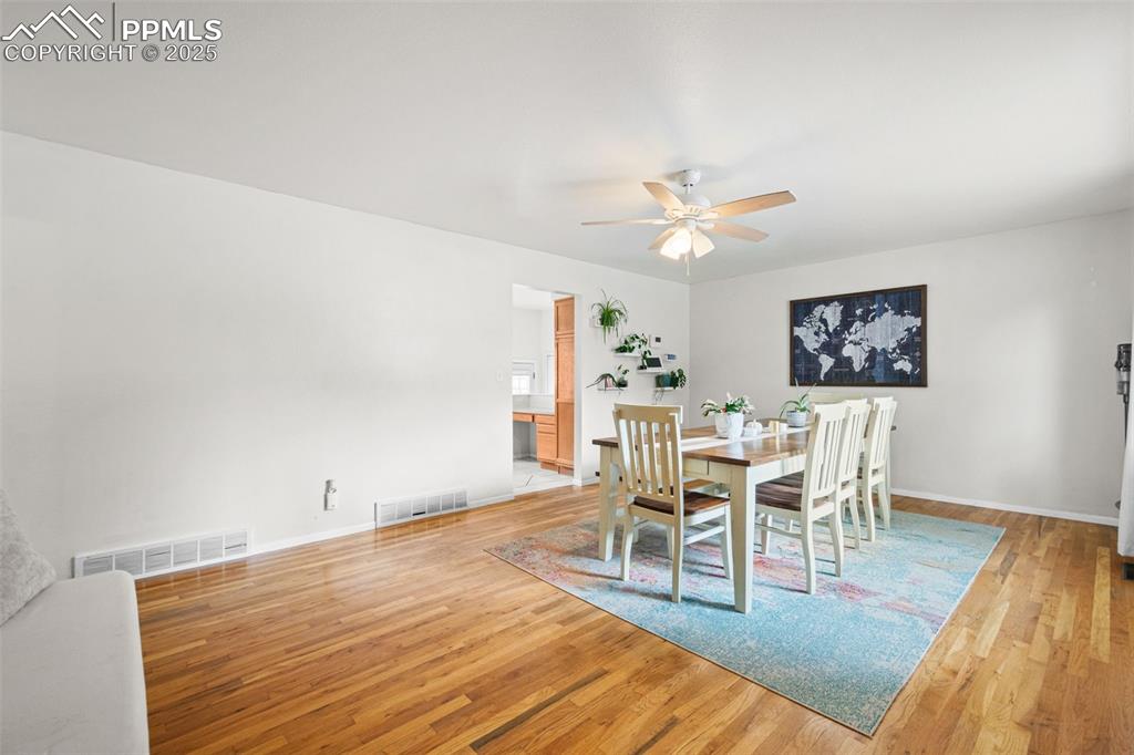 Image 4 of 33: Dining space featuring light wood-type flooring and ceiling fan