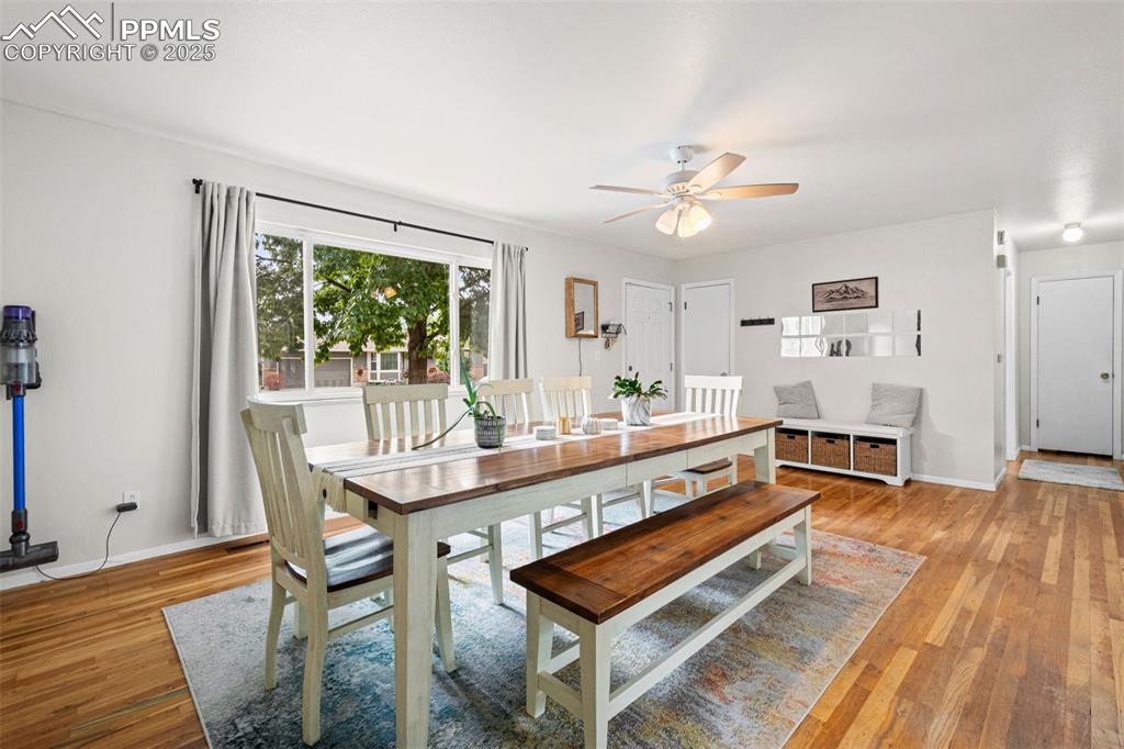 Image 6 of 33: Dining room featuring light wood-type flooring and a ceiling fan