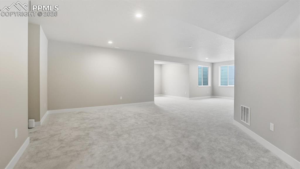 Image 34 of 50: Huge Family Room with Game Area bump out.