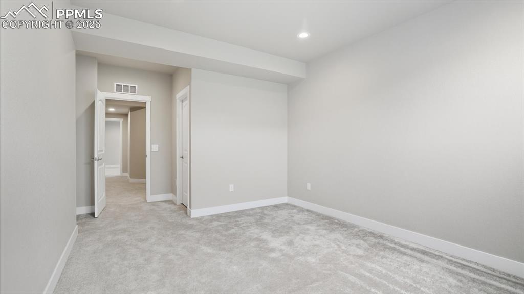 Image 41 of 50: View of Bedroom #5 from the Basement Bathroom.