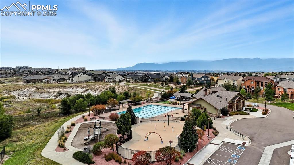 Image 48 of 50: Aerial view of home and corner lot.