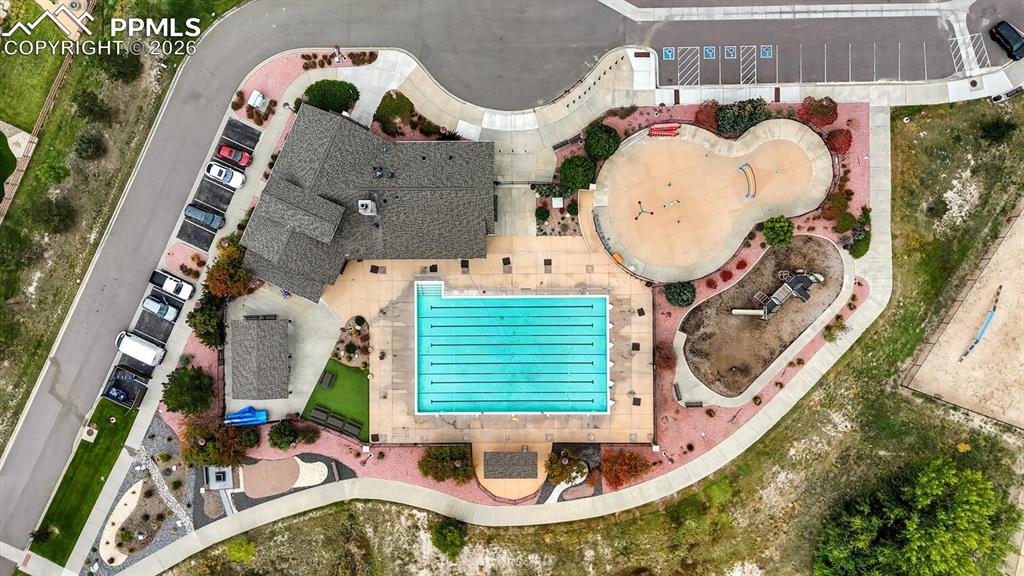 Image 49 of 50: Aerial view of community pool and playground.