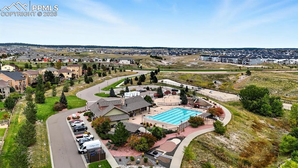 Image 50 of 50: Aerial view of community center, pool and playground.