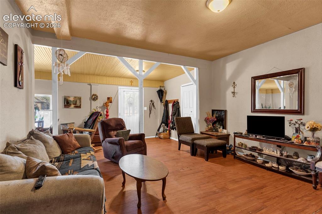 Image 7 of 31: Wood-finish flooring throughout the main living area