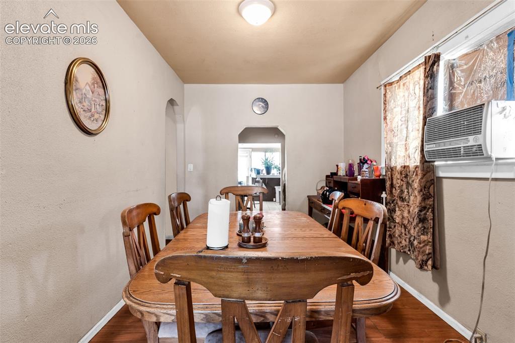 Image 9 of 31: Wood-finish flooring with neutral wall tones