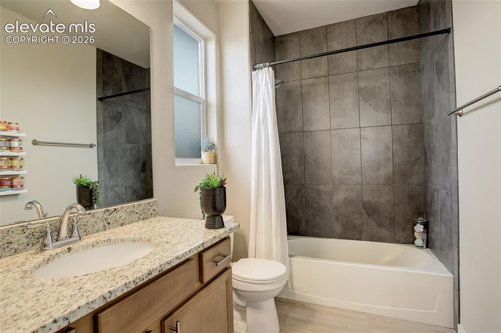 Image 22 of 50: Another Upstairs/West facing large Bedroom featuring a walk-in close and ad