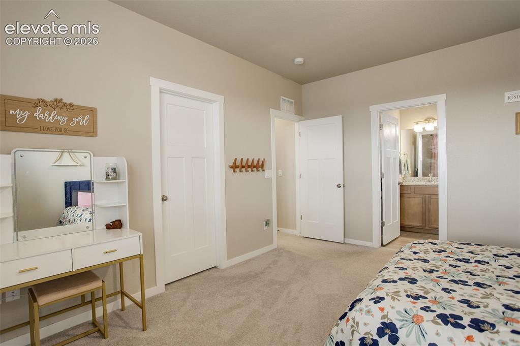 Image 24 of 50: Upper level; Bathroom Full bathroom featuring stone vanity, shower/tub with