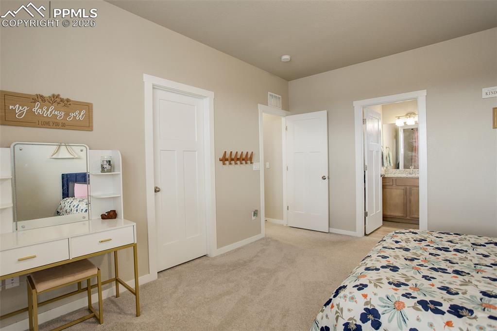 Image 25 of 50: Upper level; Bathroom Full bathroom featuring stone vanity, shower/tub with