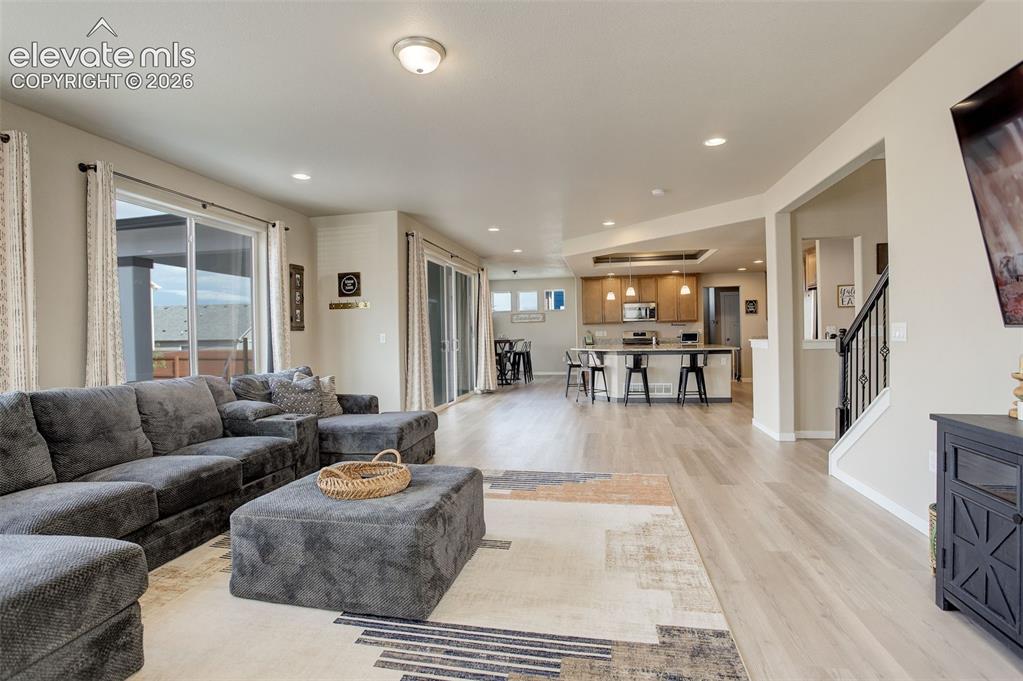 Image 36 of 50: Main level; living room. Large upgraded sliding doors to outside backyard