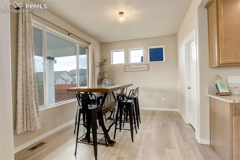 Image 43 of 50: Dining area adjoining kitchen - near walkin pantry and more oversized windo