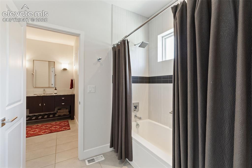 Image 35 of 50: Main Level Guest Bath Creating a Junior Suite