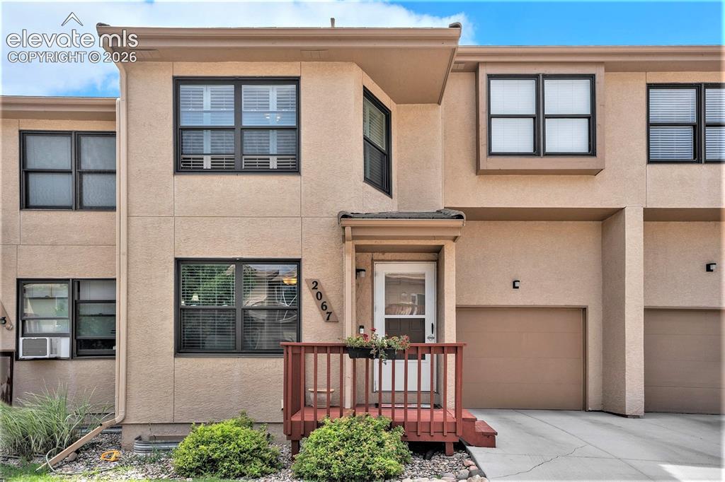 Caption: Front of home with small front deck