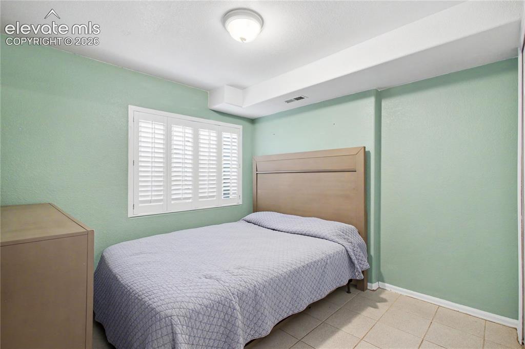 Image 20 of 25: Lower level bedroom