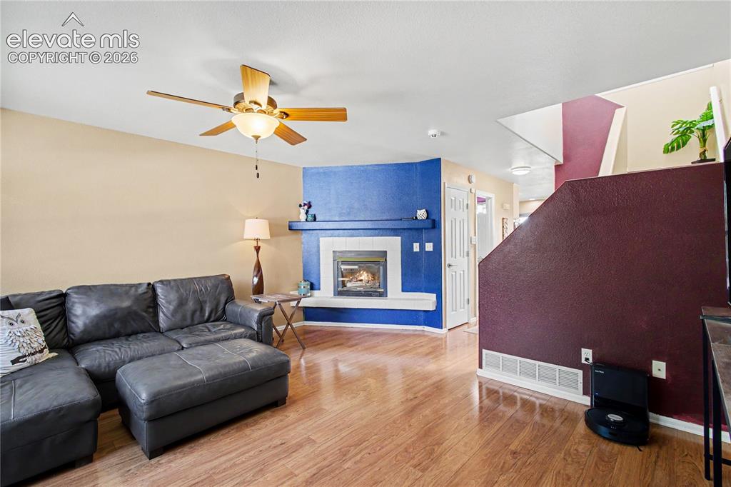 Image 4 of 25: Spacious bright living area with fireplace