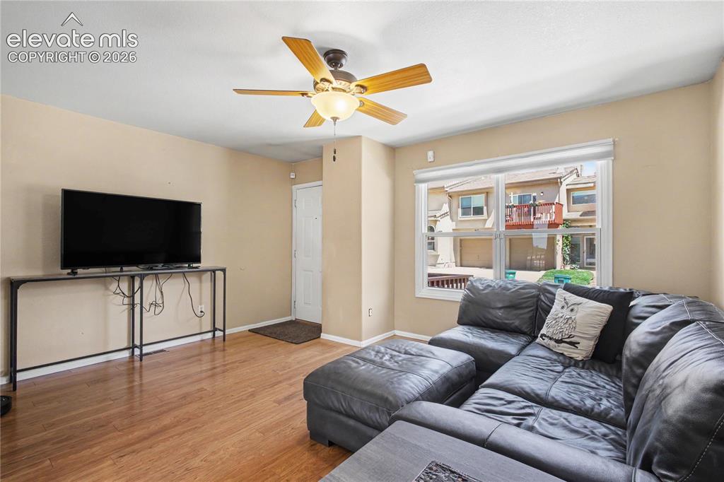 Image 5 of 25: View of living area toward front entry door