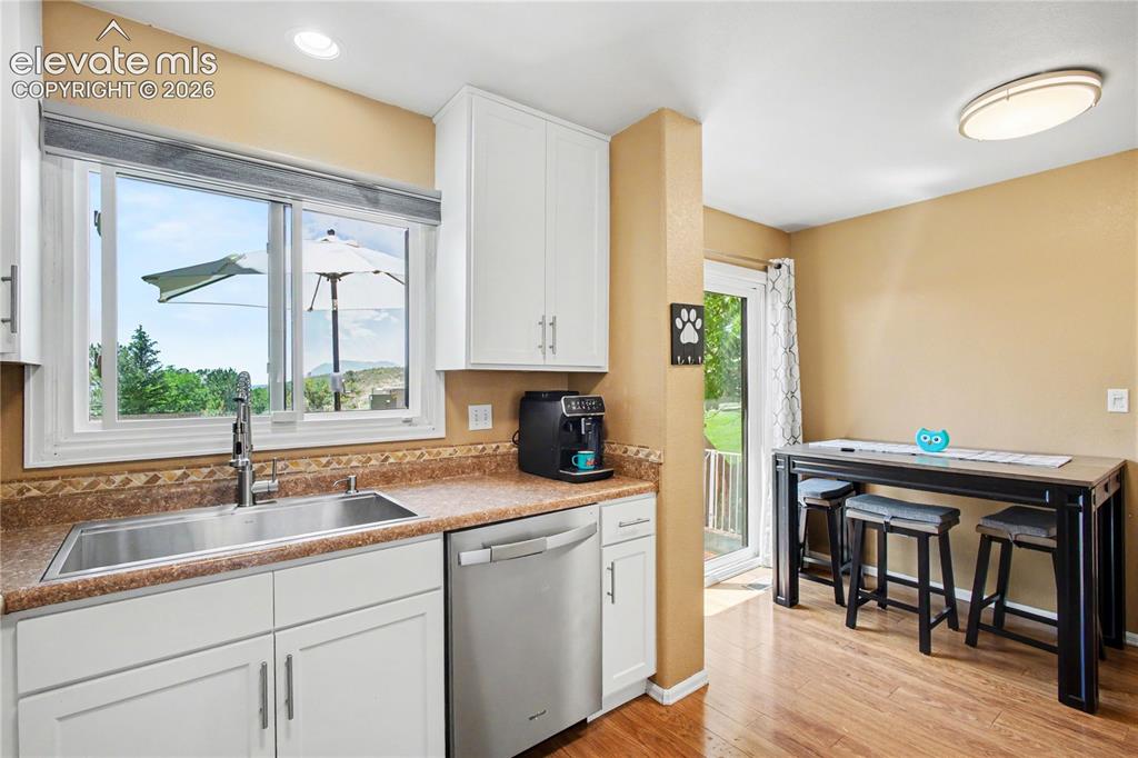 Image 9 of 25: View of kitchen and dining area