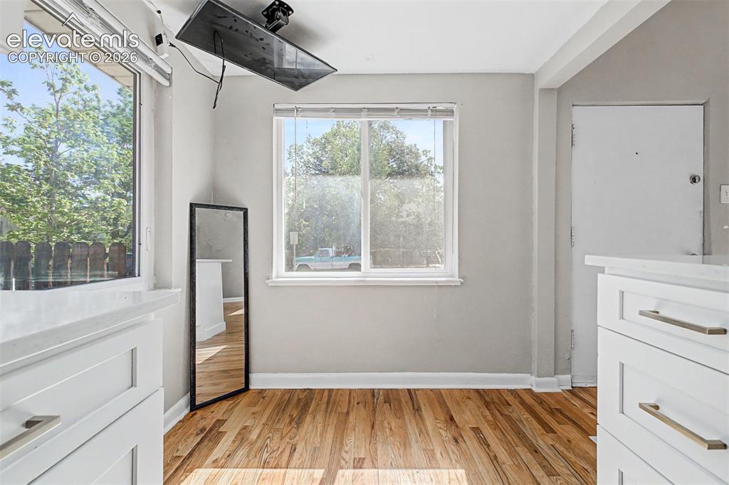 Image 19 of 40: Hardwood flooring throughout main level with walk-in closet