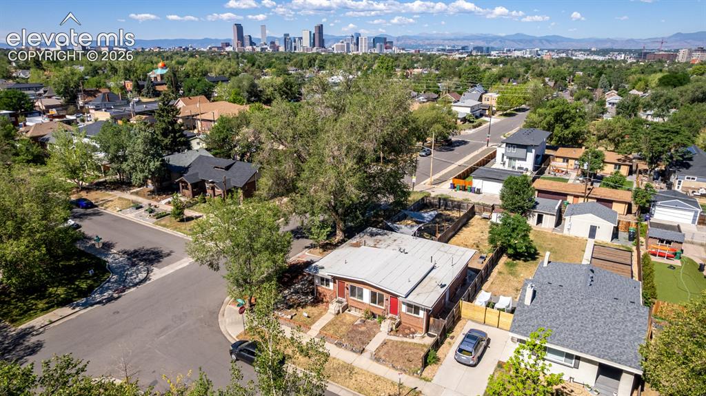 Image 33 of 40: Spacious property featuring a large backyard with mature trees, a detached 